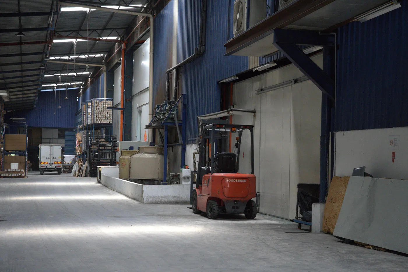 Inside the Arctic Kepong cold-storage facility, a forklift moving stock through the staging hall